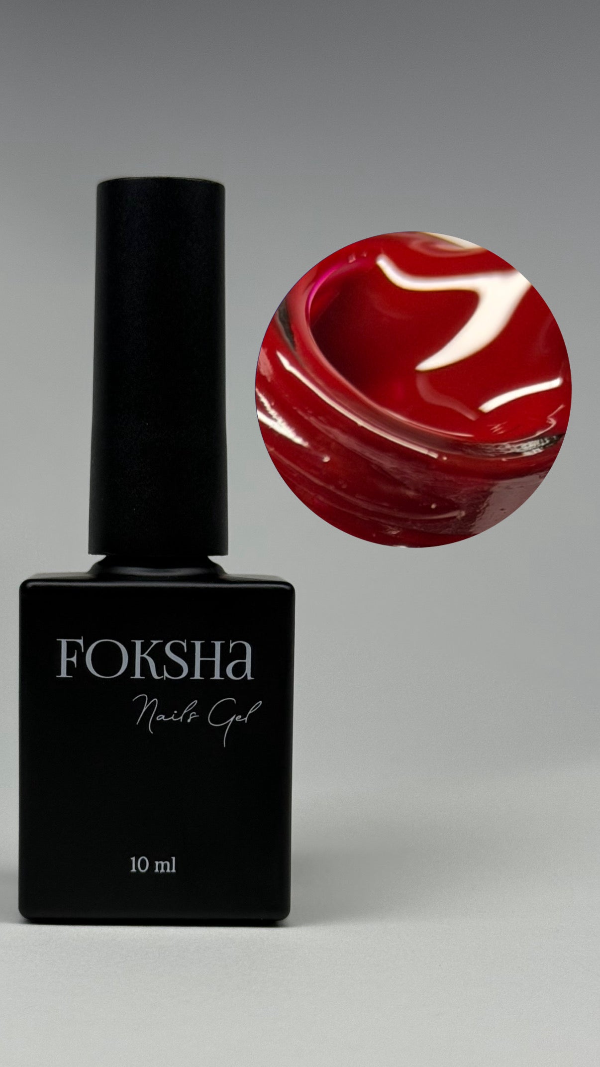 Foksha nail gel polish bottle with a swatch of red nail color on a gray background