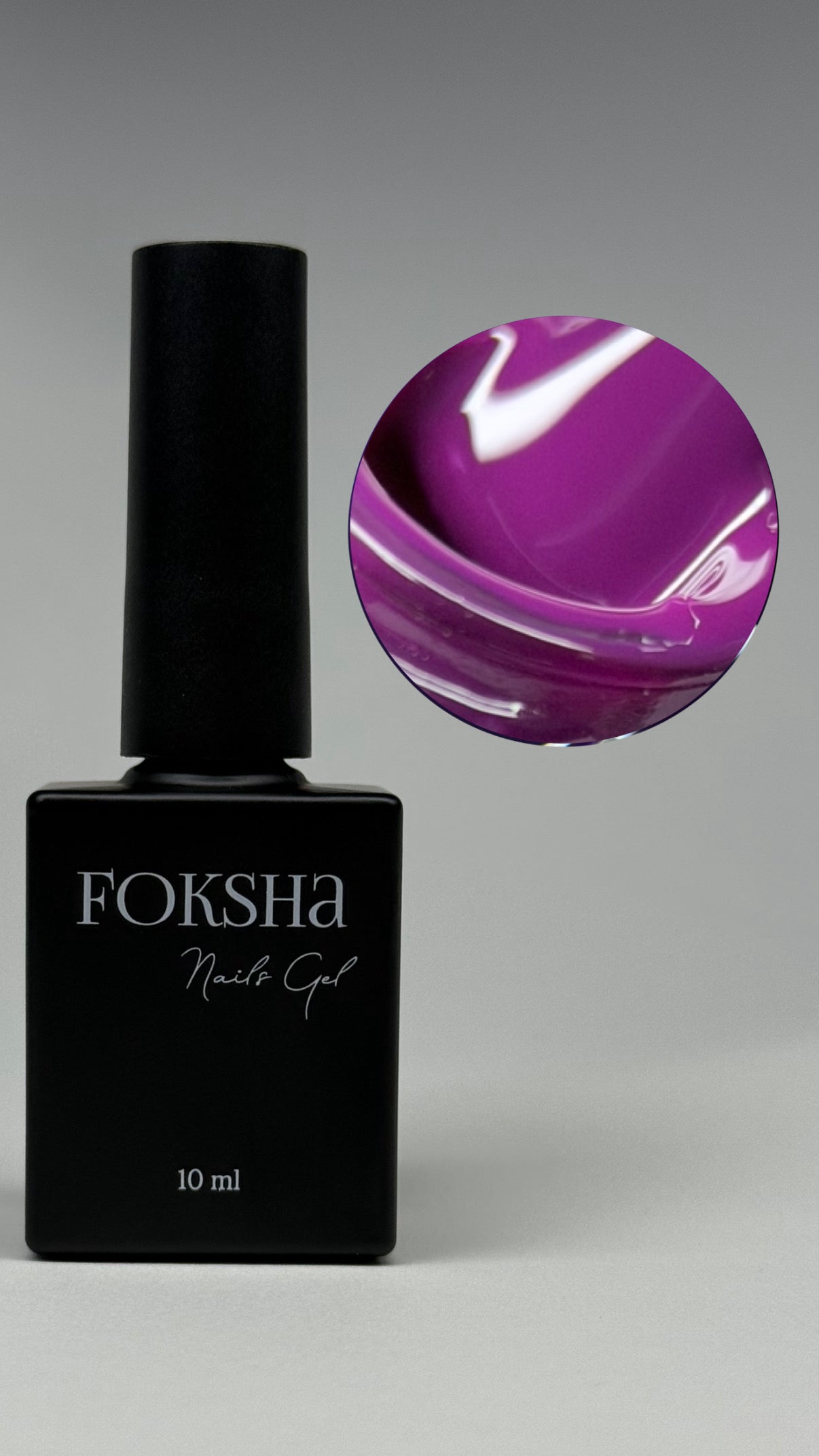 Black Foksha nail gel bottle with a purple gel on a gray background