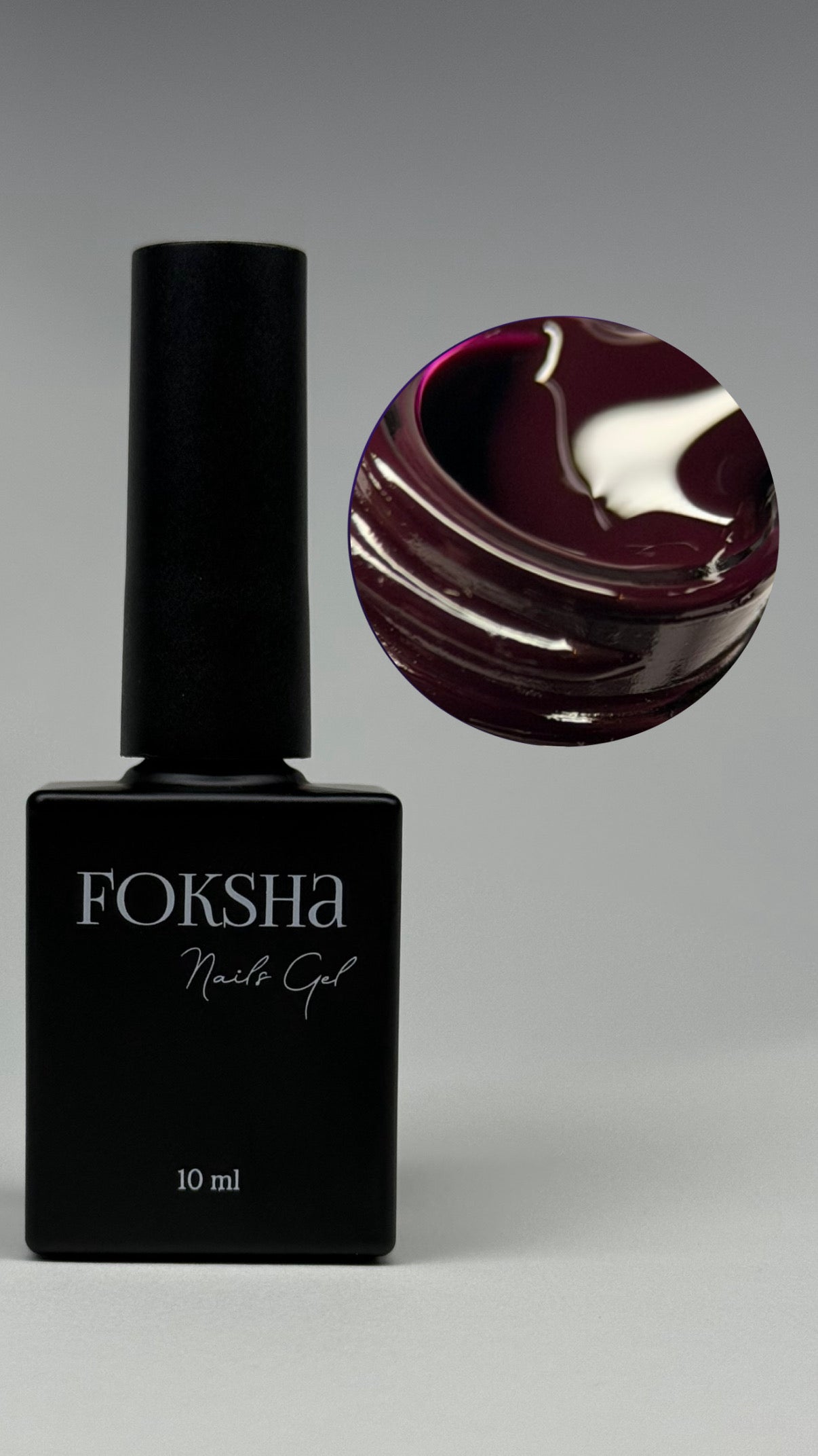 Foksha nail gel polish bottle with a dark purple nail color on a gray background