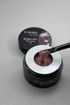 Foksha Builder Gel with a applicator on a gray background
