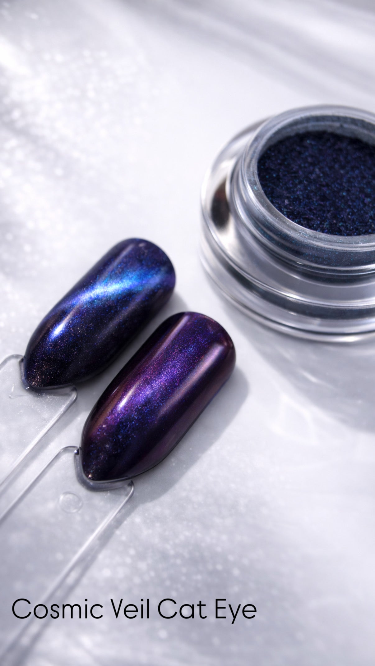 Cosmic Veil Cat Eye nail polish in a jar with two nails painted with the same color on a white background.