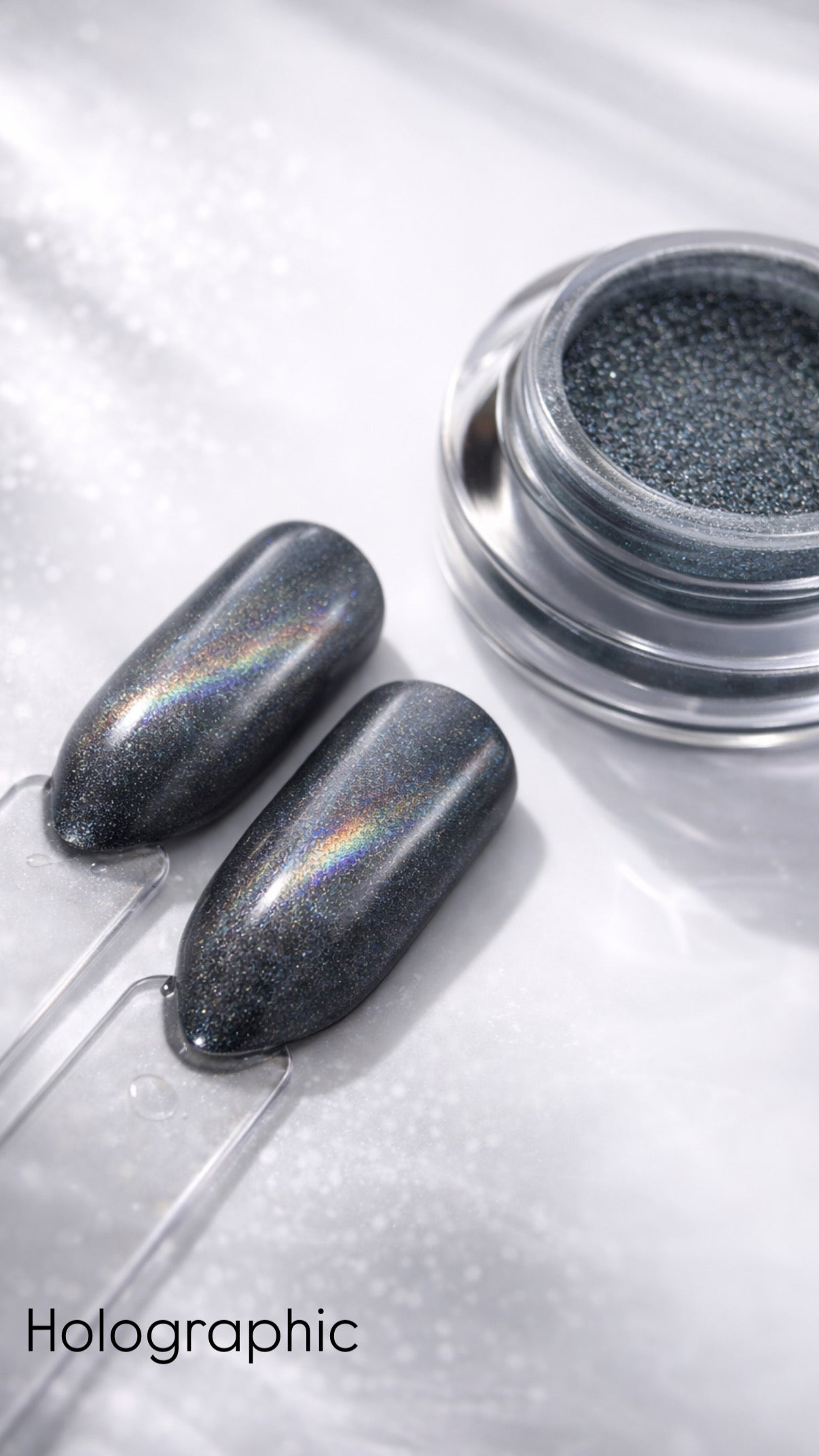 Holographic nail polish with two applied nails on a white background