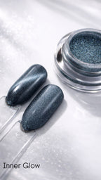Metallic nail polish with two applied nails on a white background