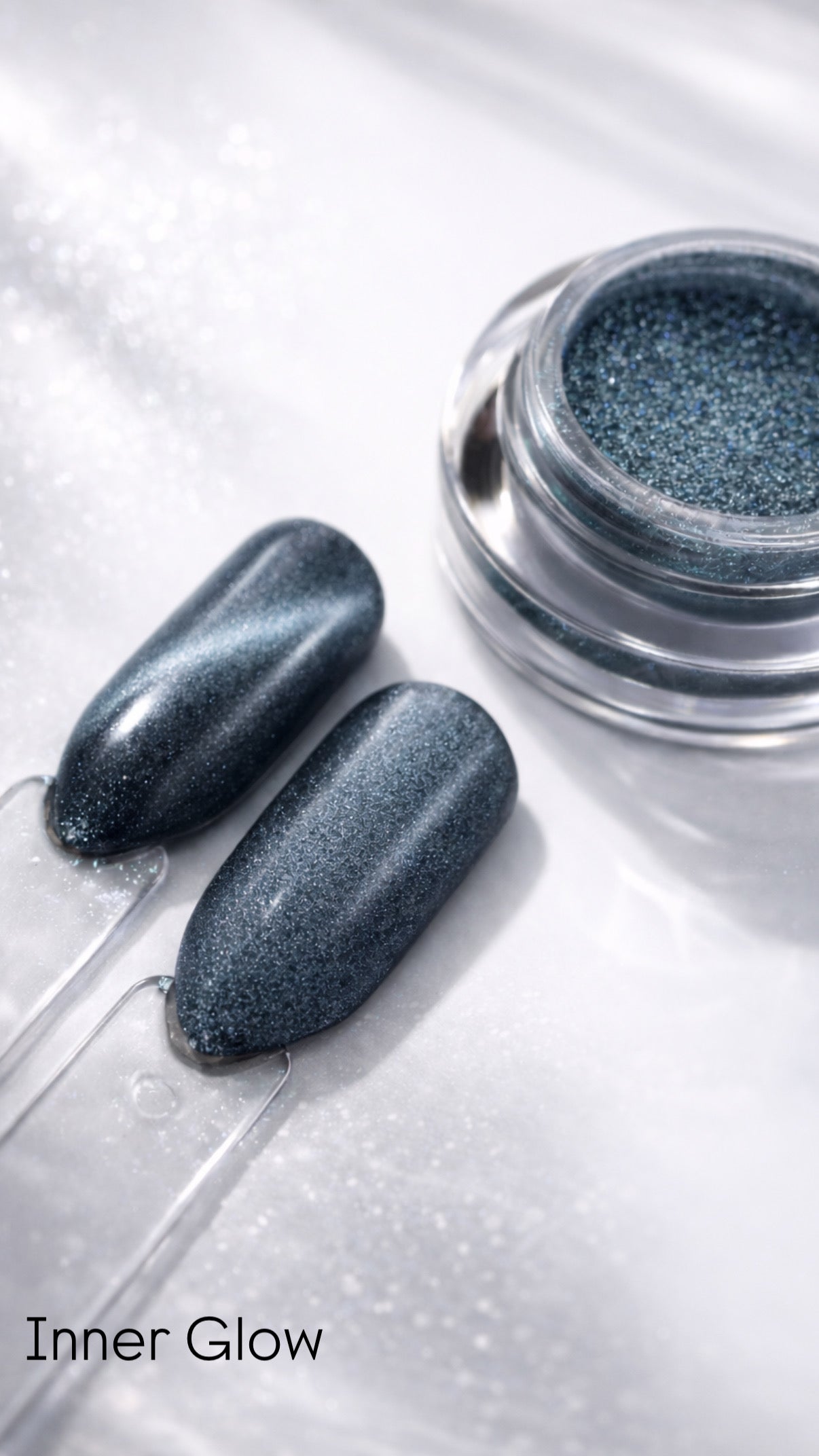Metallic nail polish with two applied nails on a white background