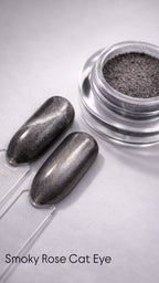 Metallic nail polish with a clear container on a light gray background