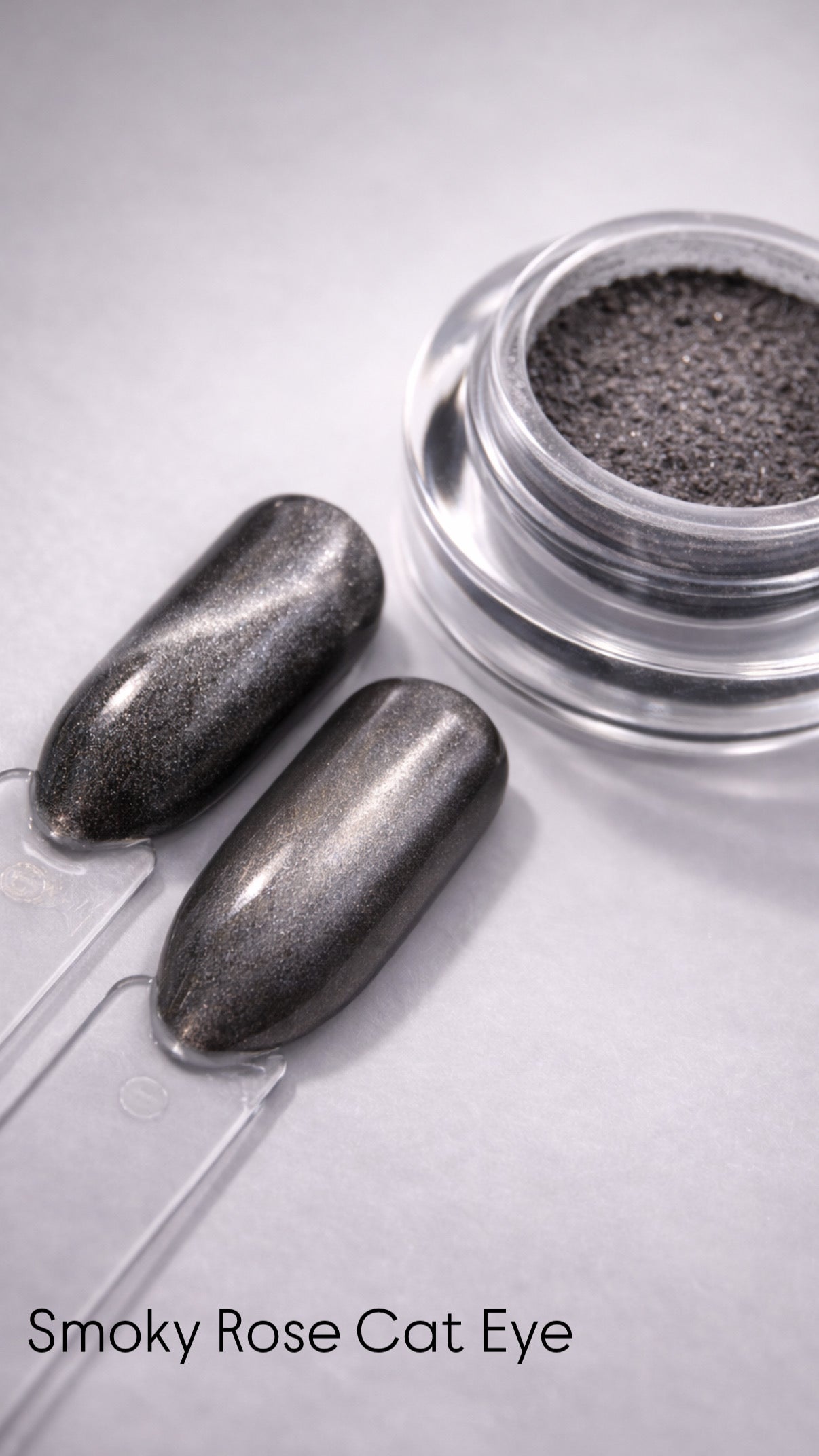 Metallic nail polish with a clear container on a light gray background