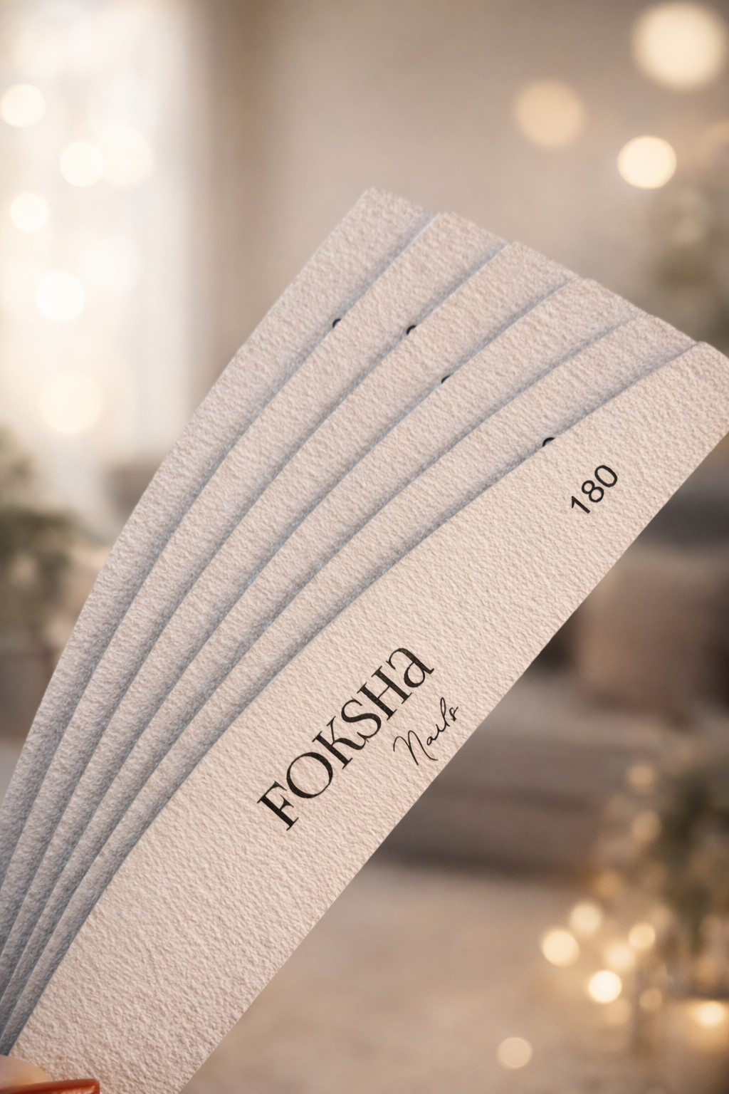 Stack of notebooks with 'FOKSHA' branding on a blurred background
