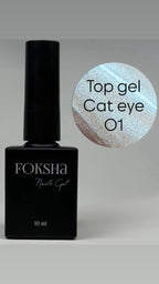 Black Foksha nail gel bottle with a sample of cat eye gel on a gray background